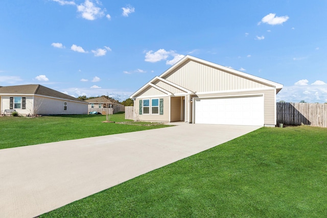 view of front of home with a front yard and a garage