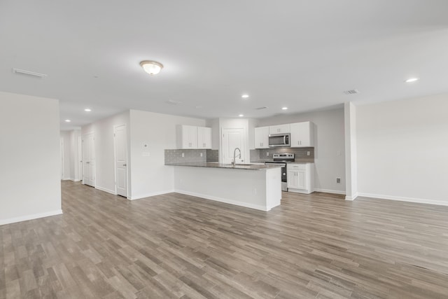 interior space with light wood-type flooring and sink