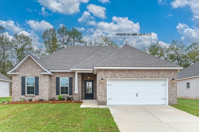 view of front of property with a garage, brick siding, concrete driveway, roof with shingles, and a front yard