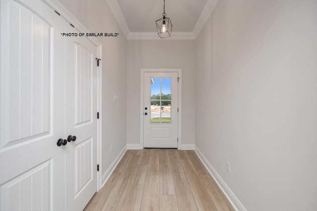 doorway with light wood finished floors, baseboards, and ornamental molding