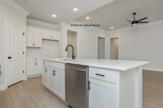 kitchen featuring white cabinets, an island with sink, crown molding, stainless steel dishwasher, and a sink