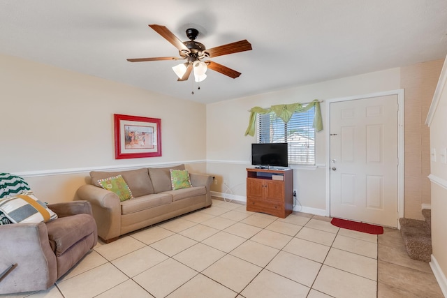 living room featuring ceiling fan and light tile patterned flooring