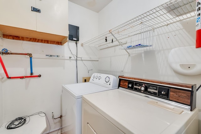 laundry room with independent washer and dryer