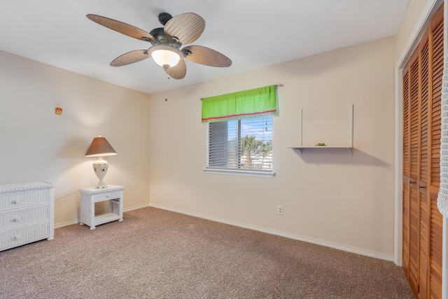 unfurnished bedroom featuring ceiling fan, a closet, and carpet floors