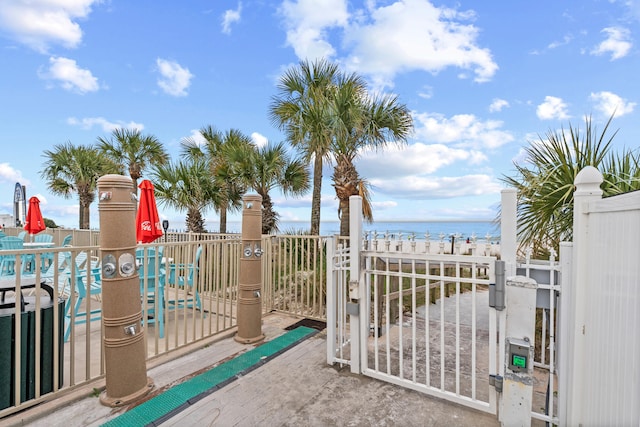 view of gate with a water view