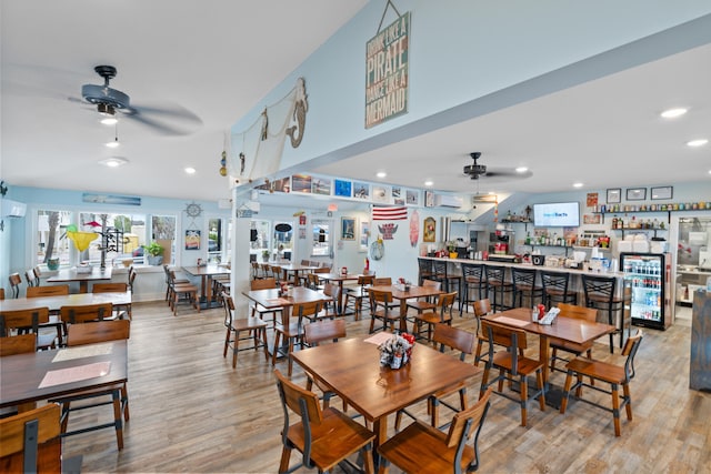 dining area featuring light wood-type flooring and ceiling fan