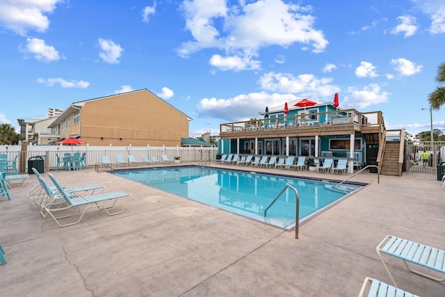 view of swimming pool featuring a patio area and a deck