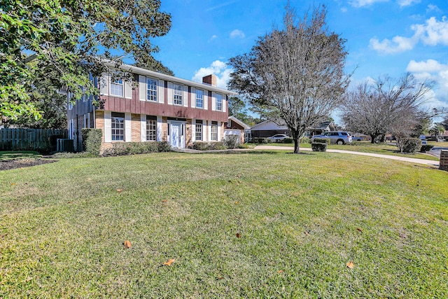 view of front facade with central AC and a front yard