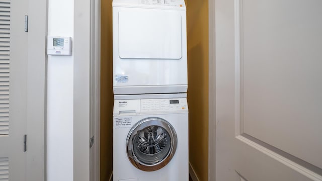 laundry area featuring stacked washer and clothes dryer