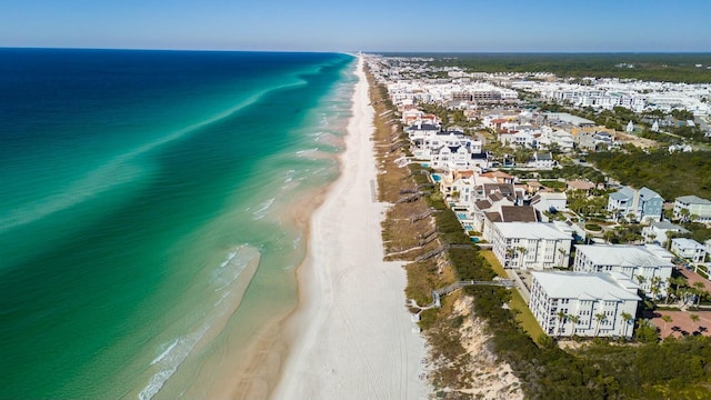 bird's eye view featuring a water view and a view of the beach