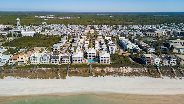 bird's eye view with a water view and a view of the beach