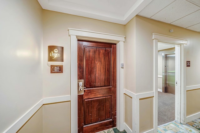 doorway with carpet floors