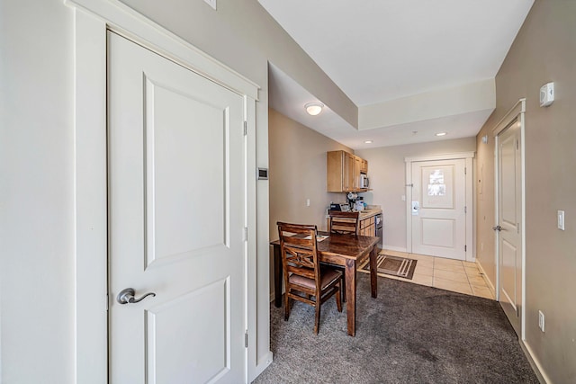 dining room featuring light colored carpet