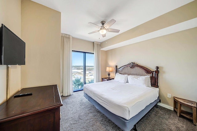 bedroom with access to outside, ceiling fan, and dark colored carpet