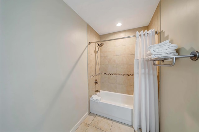 bathroom with tile patterned flooring and shower / bathtub combination with curtain