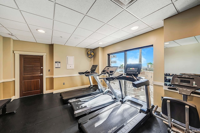 gym featuring a paneled ceiling