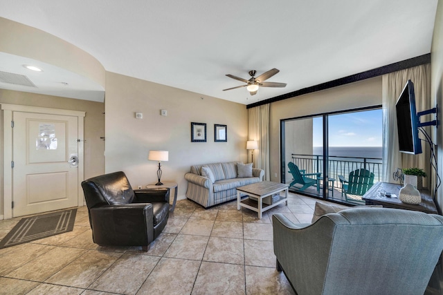 living room featuring tile patterned flooring and ceiling fan