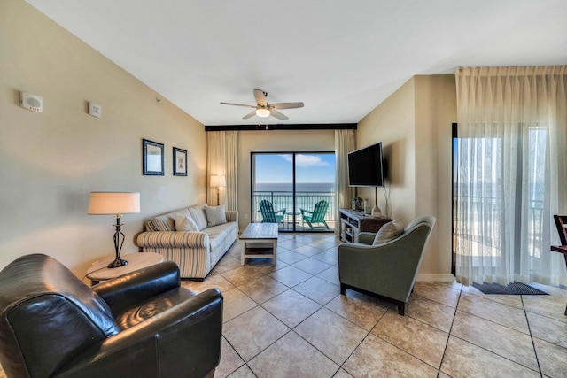 tiled living room with ceiling fan