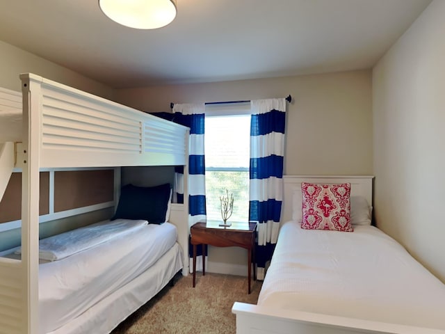 bedroom with light colored carpet