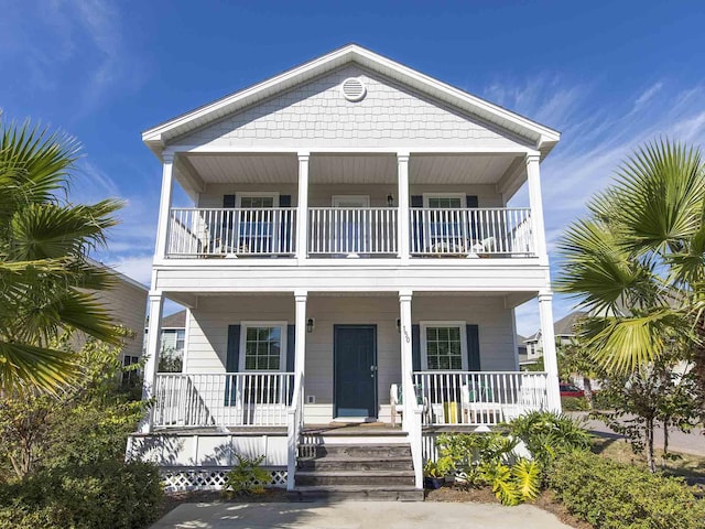 beach home featuring covered porch