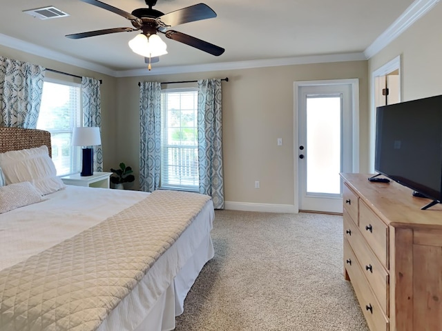 bedroom featuring ceiling fan, crown molding, and light carpet