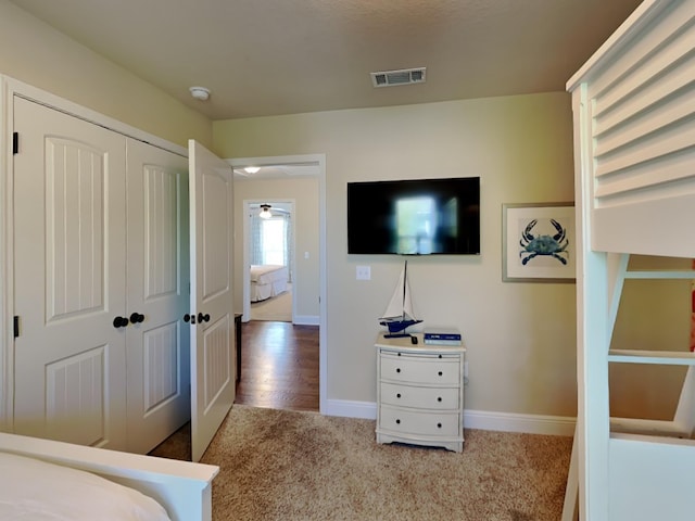 bedroom featuring carpet and a closet