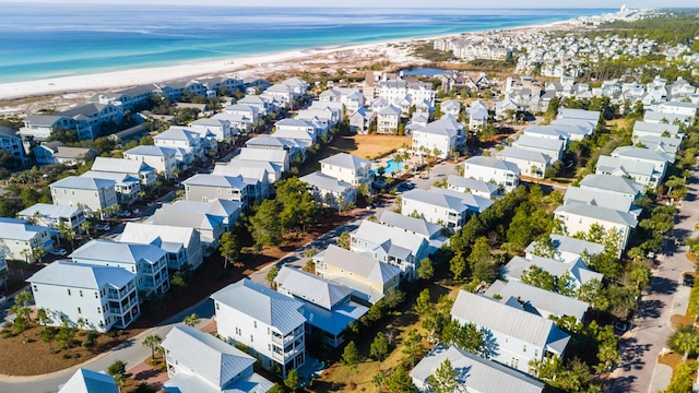 aerial view with a view of the beach and a water view