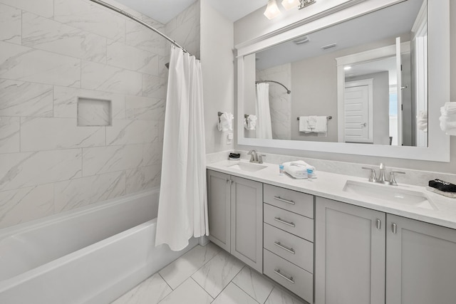 bathroom featuring vanity and shower / bathtub combination with curtain