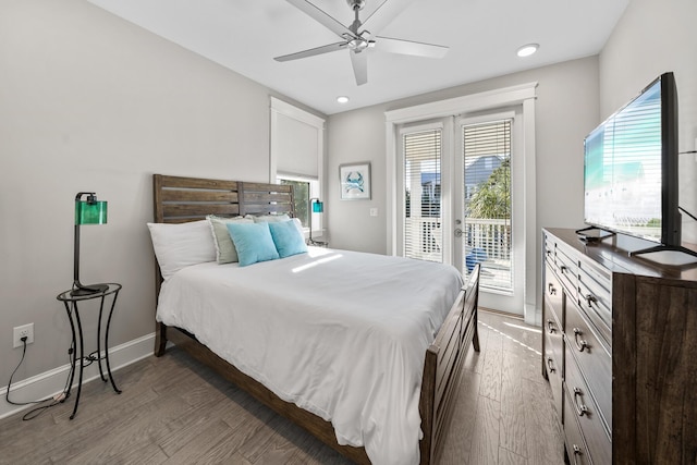 bedroom featuring access to outside, ceiling fan, and dark hardwood / wood-style floors