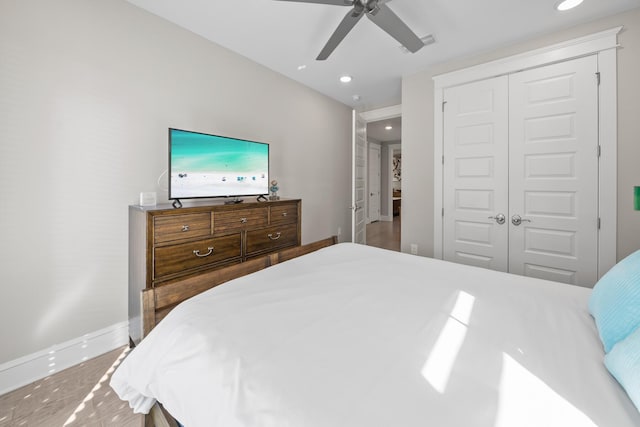 bedroom with ceiling fan and a closet