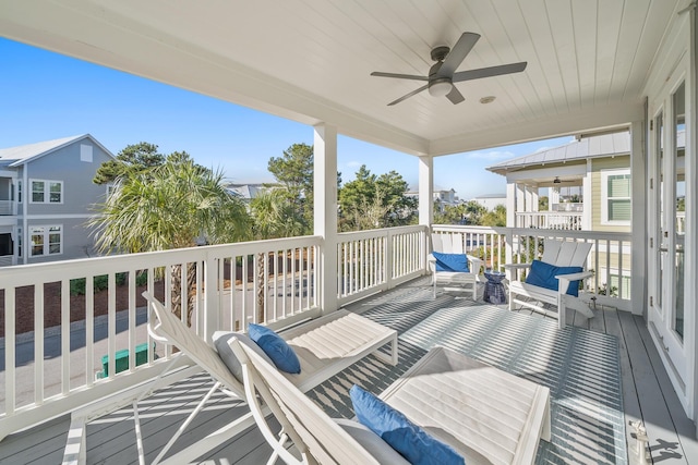 wooden deck featuring ceiling fan