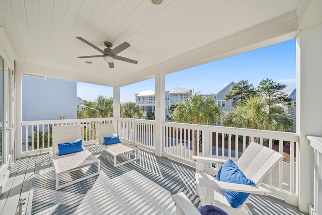 sunroom / solarium with ceiling fan and wooden ceiling