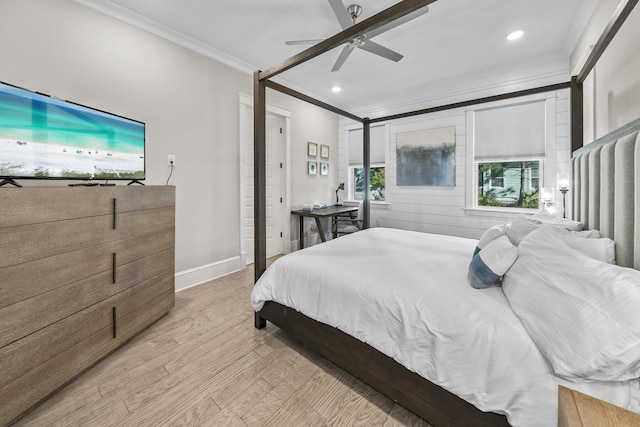 bedroom featuring light hardwood / wood-style floors, ceiling fan, and ornamental molding