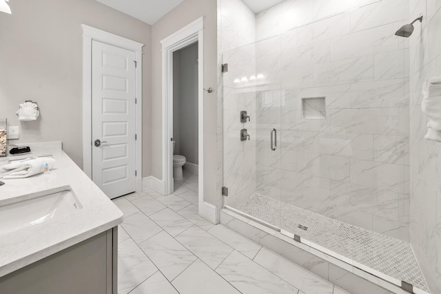 bathroom featuring vanity, an enclosed shower, and toilet