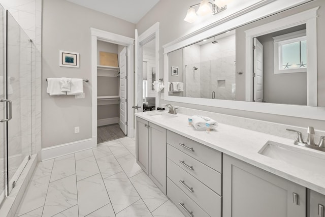 bathroom featuring vanity and a shower with shower door