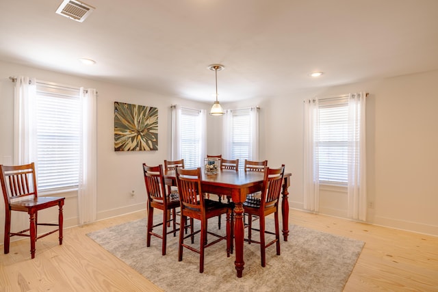 dining area with light hardwood / wood-style flooring