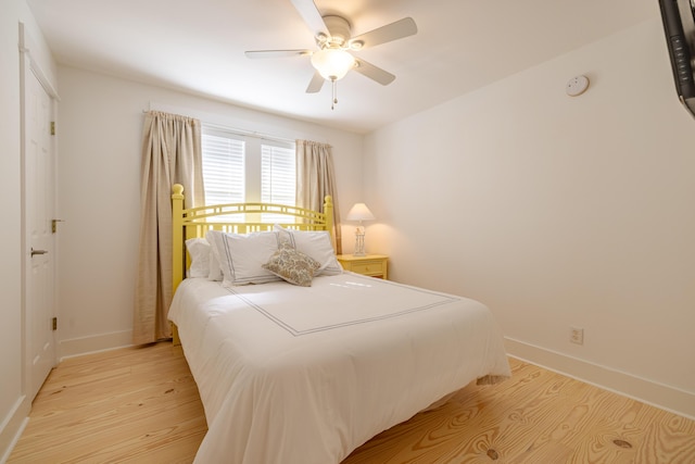 bedroom featuring ceiling fan and light hardwood / wood-style flooring