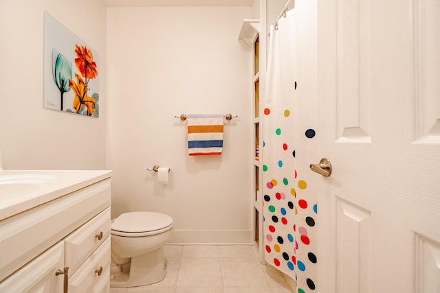 bathroom featuring tile patterned flooring, vanity, a shower with shower curtain, and toilet