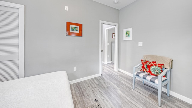 sitting room with light hardwood / wood-style floors