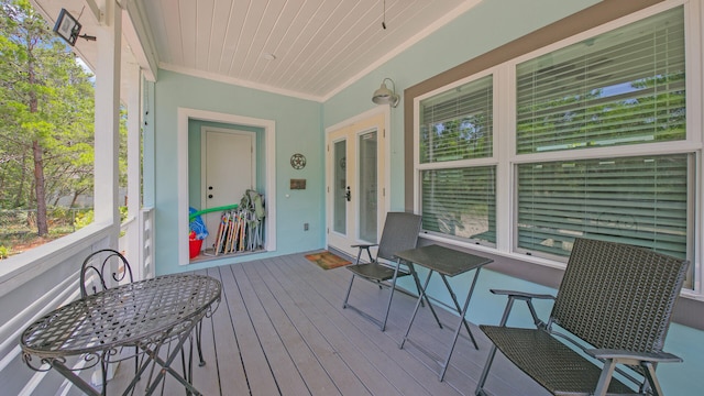 sunroom / solarium featuring wood ceiling