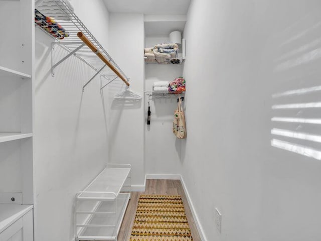 walk in closet featuring light hardwood / wood-style floors