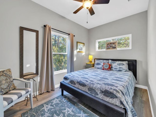 bedroom with hardwood / wood-style flooring and ceiling fan