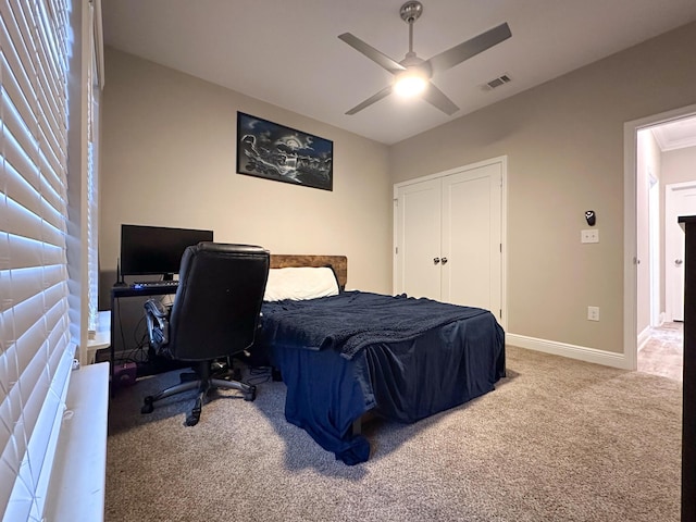 bedroom featuring carpet floors, a closet, and ceiling fan