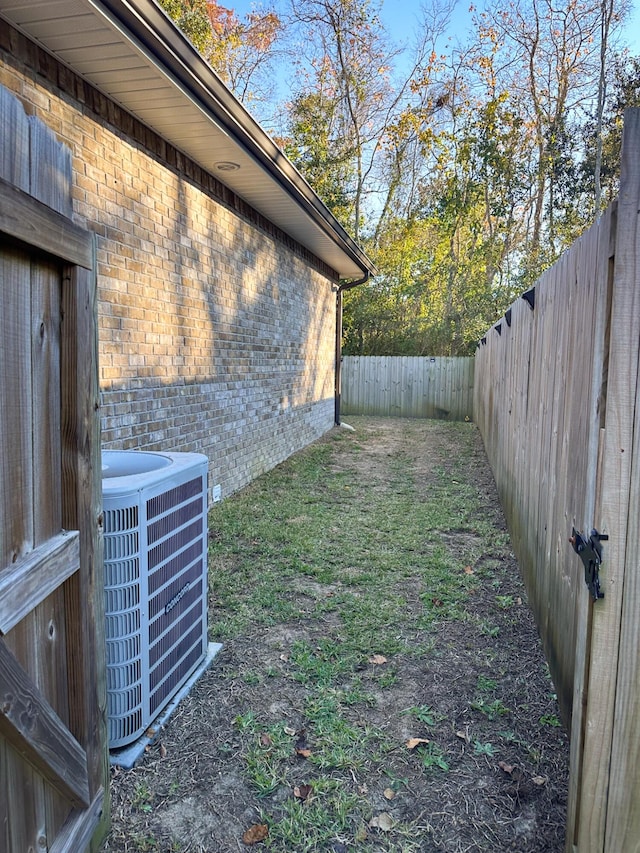 view of yard with central AC unit