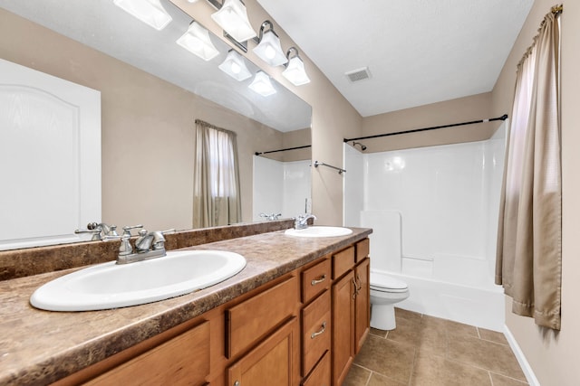 full bathroom with shower / tub combination, vanity, and toilet