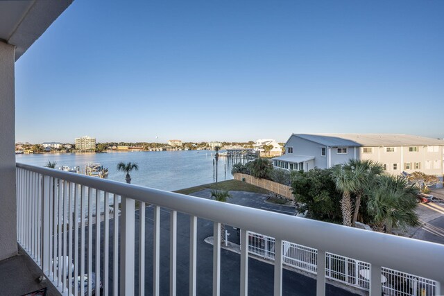 balcony featuring a water view