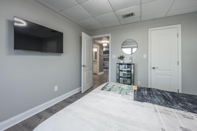 bedroom with dark hardwood / wood-style floors