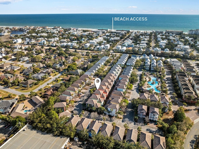 drone / aerial view with a water view and a residential view