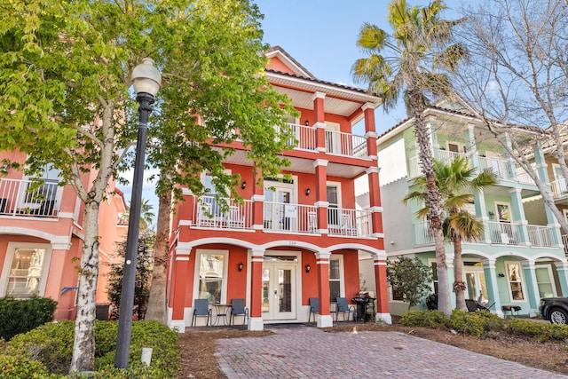 view of front facade featuring french doors and stucco siding