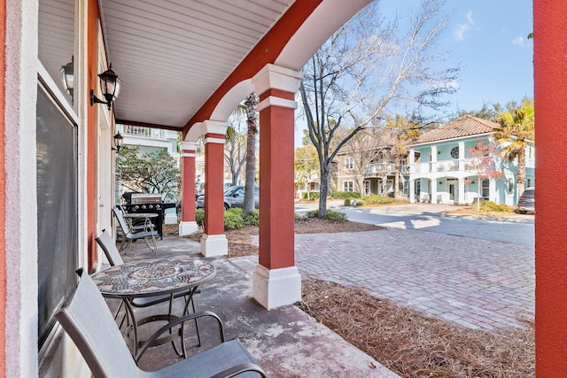 view of patio / terrace with covered porch and a residential view